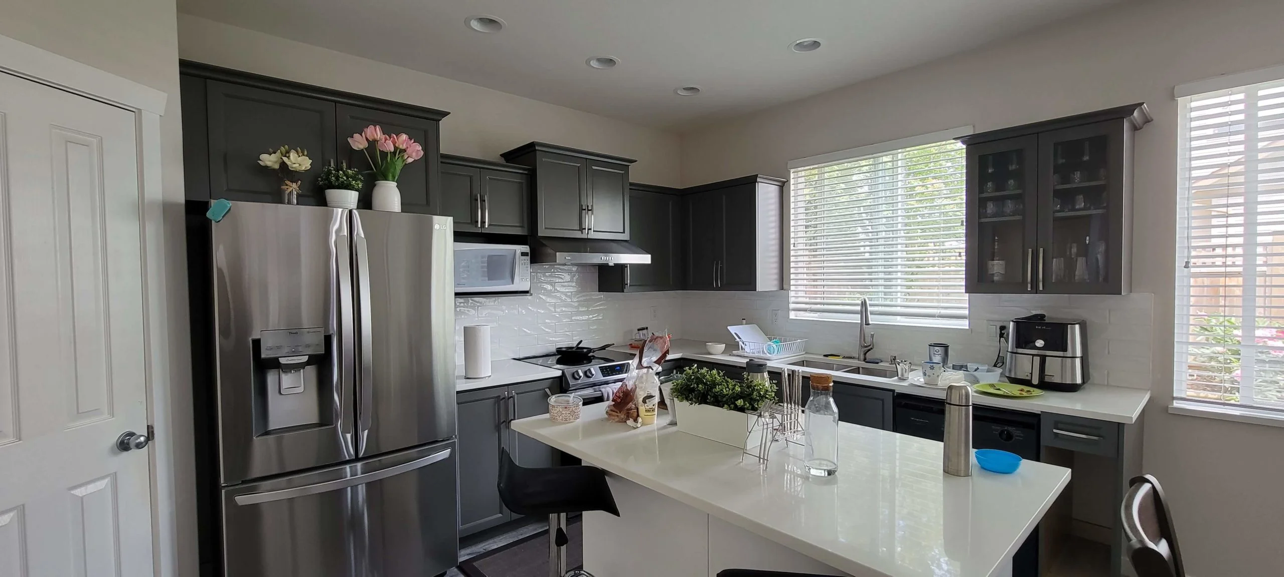 Grey kitchen with white quartz island